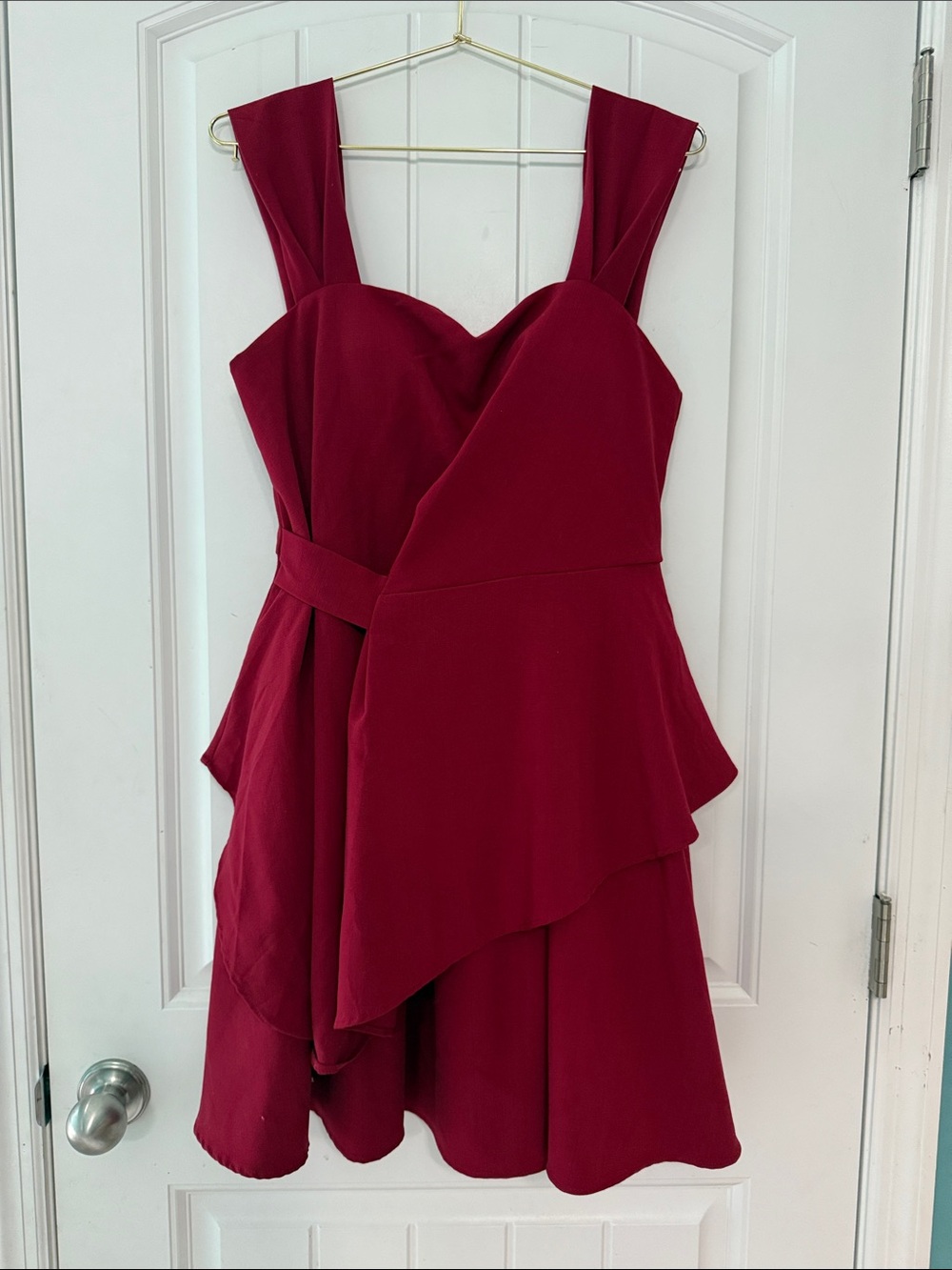 Classic Sleeveless Burgundy Mini Dress with Asymmetric Peplum